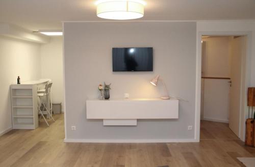 TV a/nebo společenská místnost v ubytování Ferienwohnung Küffner