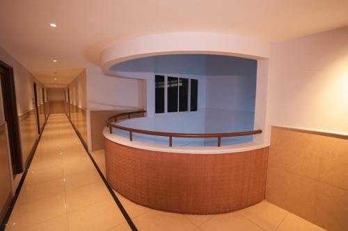 a lobby with a round counter in a building at Vaishnavi Residency in Bengaluru