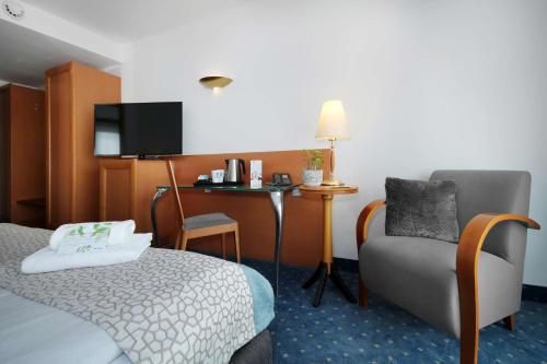 Letto o letti in una camera di Best Western Hotel Halle-Merseburg
