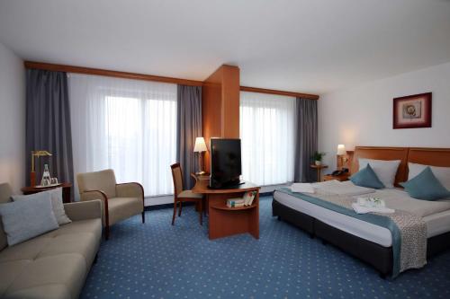 Letto o letti in una camera di Best Western Hotel Halle-Merseburg