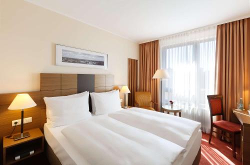 Ένα ή περισσότερα κρεβάτια σε δωμάτιο στο Best Western Hotel Bamberg