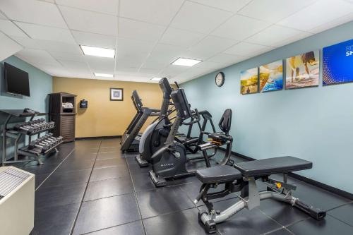 a gym with treadmills and exercise bikes in a room at Comfort Inn & Suites Logan International Airport in Revere