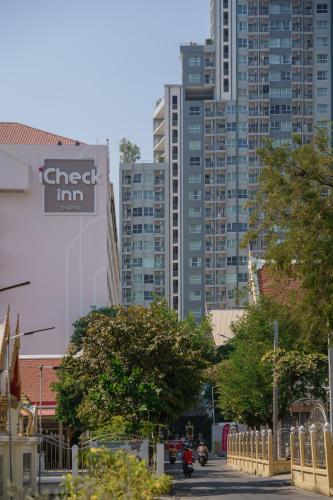 a street in a city with tall buildings at iCheck inn Thapra in Bangkok