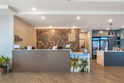 a lobby of a restaurant with a reception desk at Comfort Suites Fort Myers East I-75 in Fort Myers