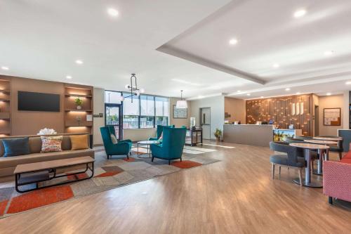 a living room with a couch and chairs at Comfort Suites Fort Myers East I-75 in Fort Myers