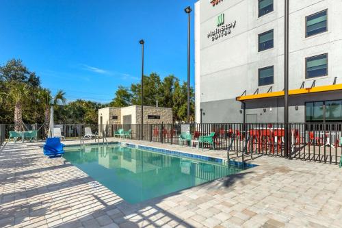 a swimming pool in front of a building at Comfort Suites Fort Myers East I-75 in Fort Myers