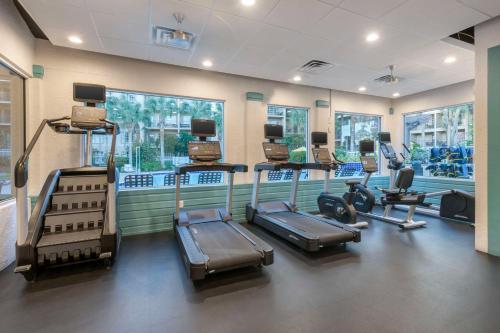 a gym with several cardio equipment in a room at Hilton Vacation Club Aqua Sol Orlando West in Orlando
