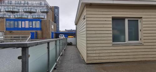 a building with a window on the side of it at Jacobus in Egmond aan Zee