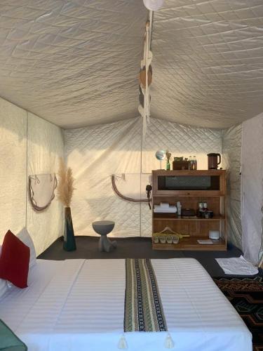 a bedroom with a large bed in a tent at Long Hải Channel Beach Resort in Long Hai
