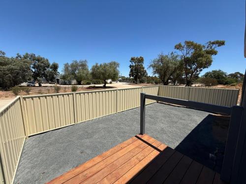 a deck with a fence and a wooden ramp at Woomelang Cabin Silo Trail Two Bedroom Cabin Queen and KSing in Woomelang