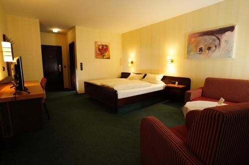 Postel nebo postele na pokoji v ubytování Hotel Central