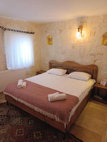 Ένα ή περισσότερα κρεβάτια σε δωμάτιο στο Asma Cave House