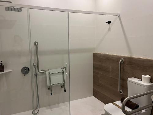 a shower stall in a bathroom with a toilet at Apartments Vent de Vela in Valencia