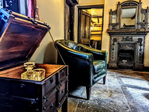 a room with a desk and a chair and a dresser at Entire Castle & Grounds for 18, Banquet Hall & BBQ in Trowbridge