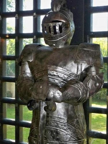 a metal statue of a man standing on a fire hydrant at Entire Castle & Grounds for 18, Banquet Hall & BBQ in Trowbridge