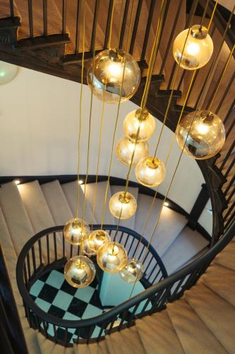 a bunch of lights hanging from a ceiling at Stunning Town Centre Apartments with Spa facilities in Morpeth