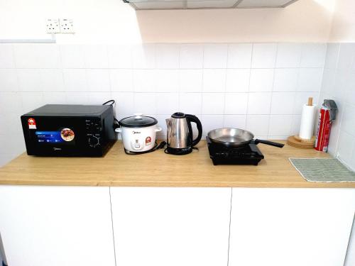 Dapur atau dapur kecil di Aevia Home Bayview Apartment at PD