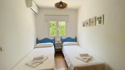 Postel nebo postele na pokoji v ubytování Villa Áncora