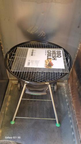 a metal rack with a newspaper on top of it at Bauhaus In Wonju in Wonju