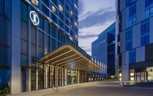 an external view of a building with a sign on it at InterContinental Tashkent by IHG in Tashkent