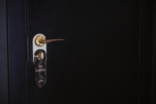 a black door with a black and white door knob at The Donna Portals in Portals Nous