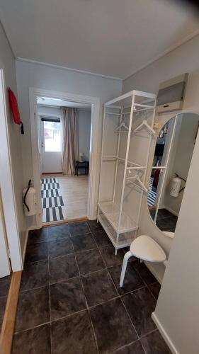 a room with a room with a shelf and a mirror at 4 bed apartment close to Branäs resort in Likenäs
