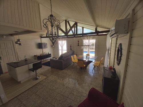 a living room with a couch and a table at Beautiful house in the campoline the best neighborhood of sorocaba in Sorocaba