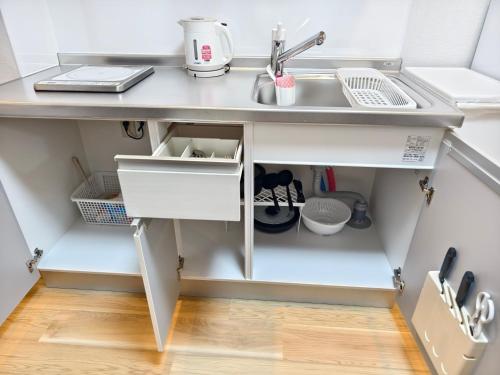 Cucina o angolo cottura di Issyuku Hotel Kotobuki Sanchome