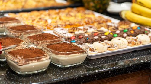 a buffet of desserts and other pastries on a table at Ayasofya Hotel - Special Class in Istanbul