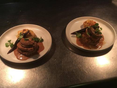 two plates of food sitting on a table at Casa Di fiore in Maubourguet