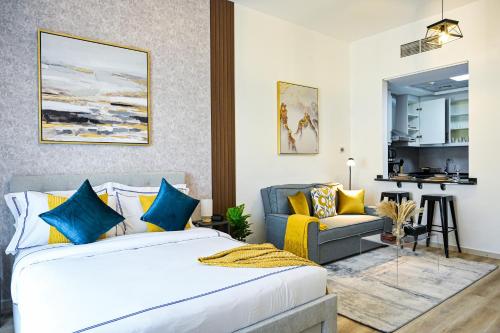 a bedroom with a bed and a couch at Modern Studio in Discovery Gardens, Close to Metro in Dubai