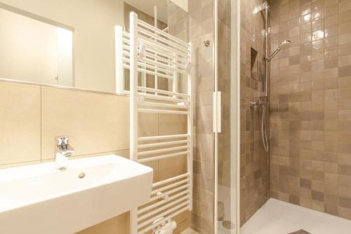 a bathroom with a sink and a shower at 8 Meereswunder in Rostock