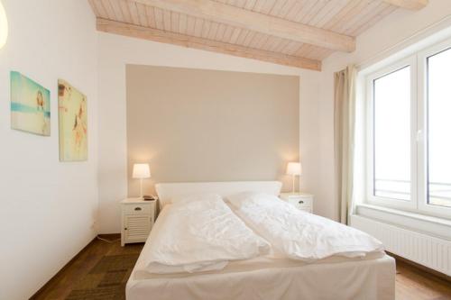 Ένα ή περισσότερα κρεβάτια σε δωμάτιο στο Sailorlodge - Versteck am Strom