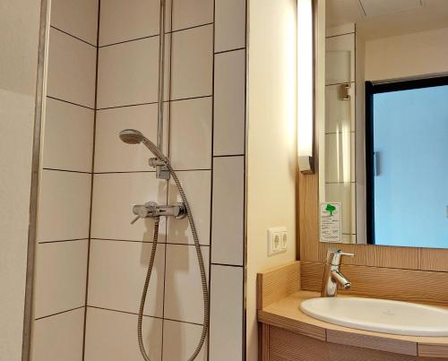 Koupelna v ubytování Heinrich Pesch Hotel