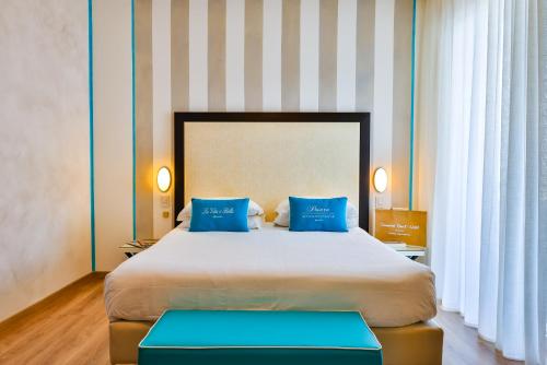 A bed or beds in a room at UNAHOTELS Imperial Sport Hotel