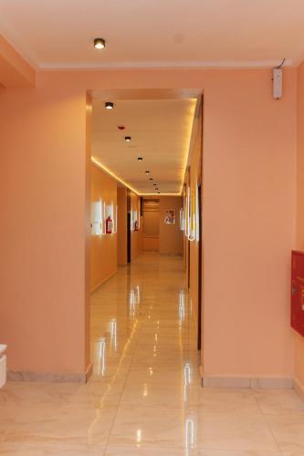 a hallway in a hospital with a long corridor at The Manor Hotel by Luckzi in Owerri