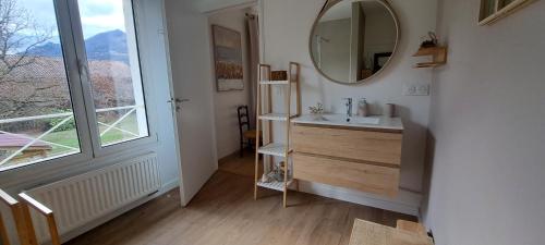 a bathroom with a sink and a mirror at Chambre d'hôte de Reymure in Vif