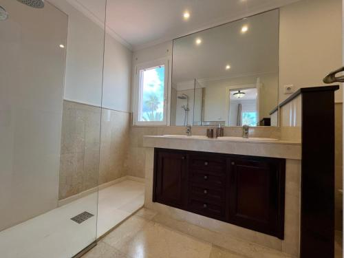 a bathroom with a large sink and a shower at Brisa Vacacional - Adults Only in Corralejo