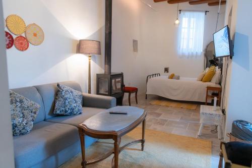 a living room with a couch and a bed at 7Kamares in Pano Lefkara