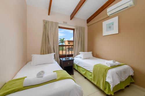 Ένα ή περισσότερα κρεβάτια σε δωμάτιο στο San Lameer 2802 - 4 Bedroom Classic - 8 pax - San Lameer Rental Agency