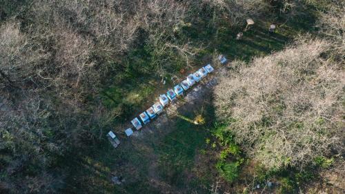 an overhead view of a group of cars in a field at Green Ranch Stara Maslina in Kotor