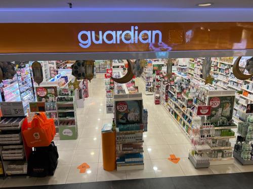 a grocery store aisle with a gorden sign in a store at SS15 Courtyard Subang Jaya Sunway Home Cinema Projector Studio 120 Inches in Subang Jaya