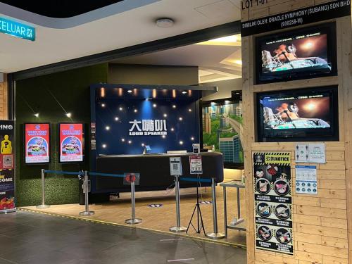 a showroom with two televisions on a wall at SS15 Courtyard Subang Jaya Sunway Home Cinema Projector Studio 120 Inches in Subang Jaya