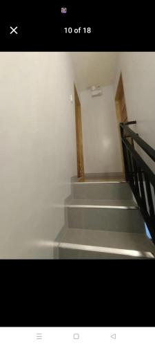 a picture of a stairway with a stair case at Alupit Transient in Jagna