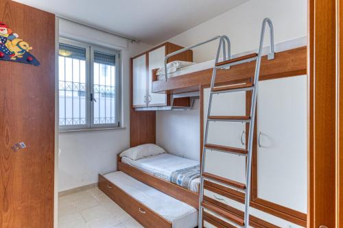 Ένα ή περισσότερα κρεβάτια σε δωμάτιο στο Casa Raffaele