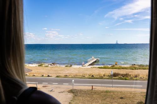 a view of the ocean from a bus window at Nyborg Strand Hotel & Konference in Nyborg