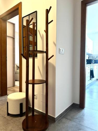 a wooden shelf in a room with a mirror at Nyska Apartment - Self Check-In 20h - Parking in Wrocław
