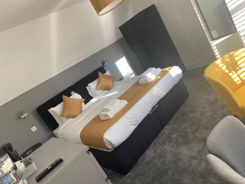 a bedroom with a large bed in a room at The Station Hotel in Alness