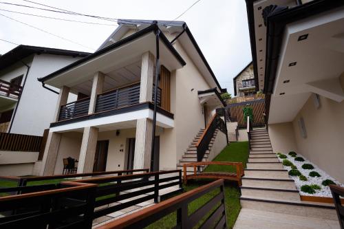 a house with stairs leading up to it at Vila Sofija Banja Vrujci in Gornja Toplica