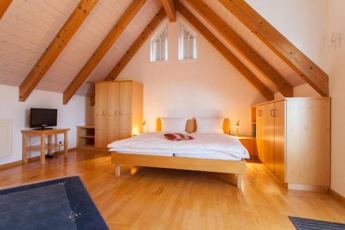 a bedroom with a bed in a attic at Storchen Restaurant Hotel in Bad Krozingen